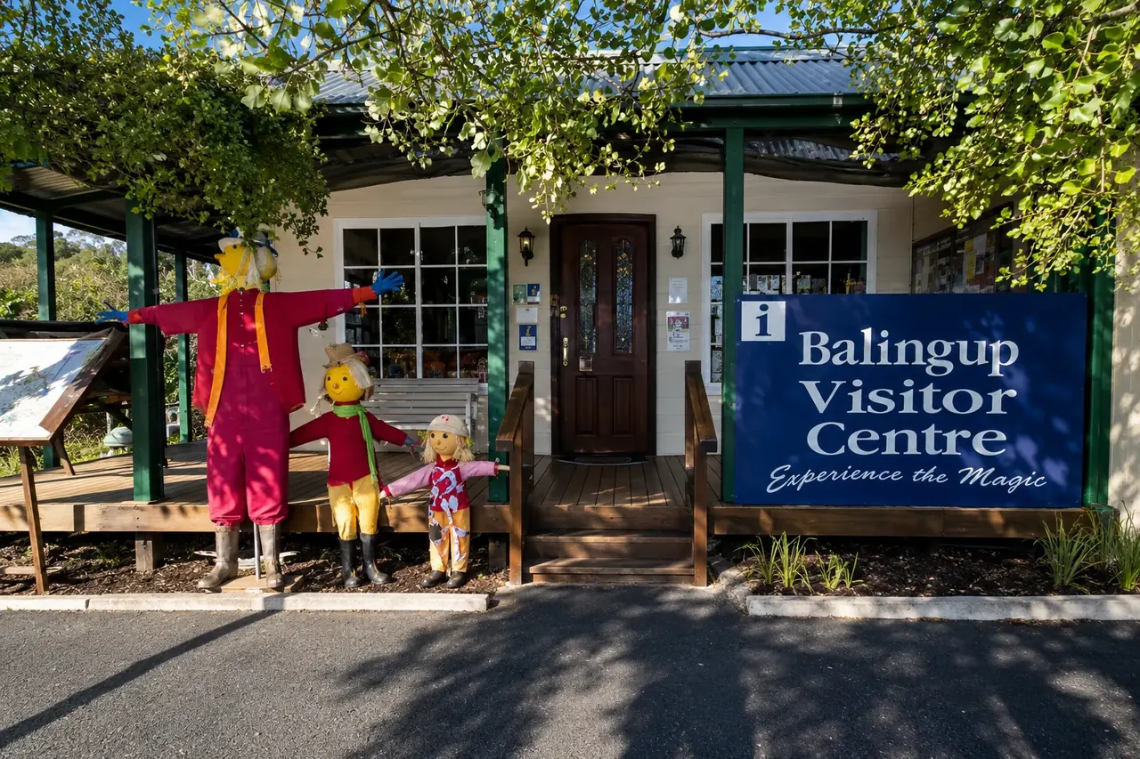 The Balingup visitor-centre cottage, its scarecrow figures out front